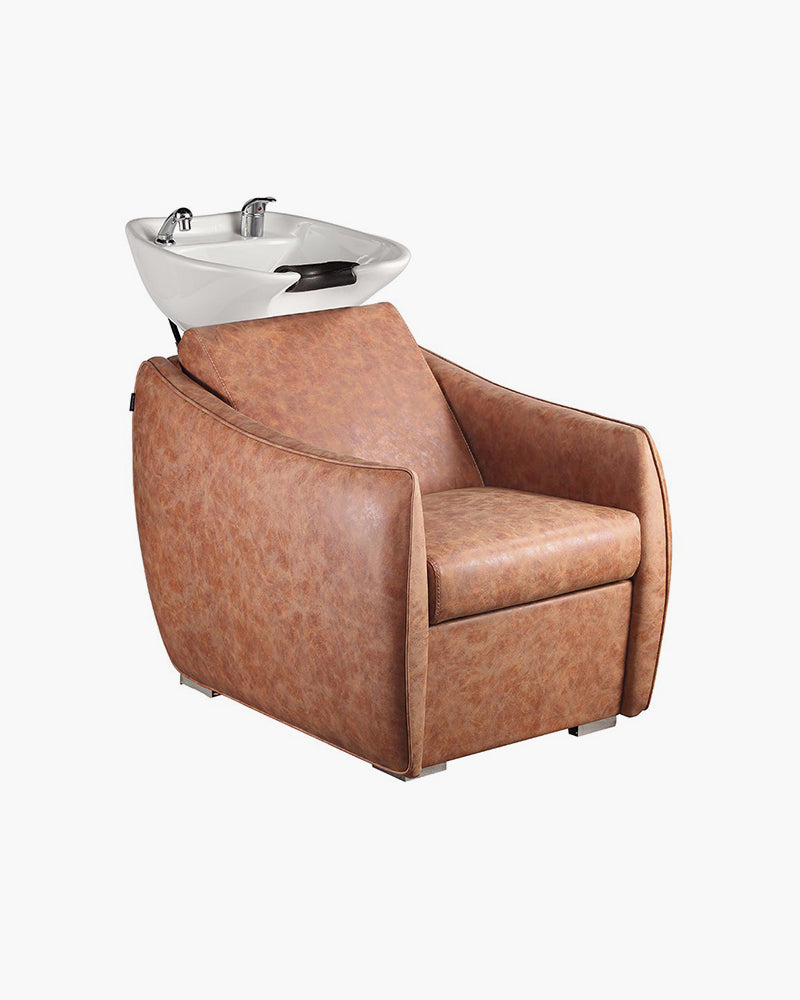 Brun vaskestol til frisør, på grå baggrund